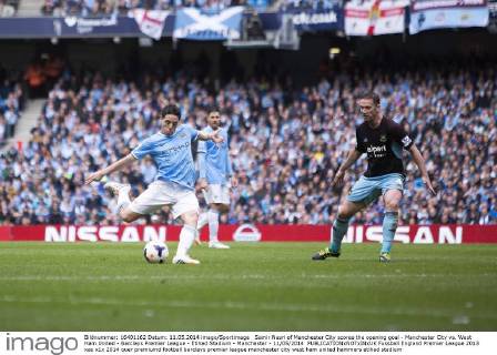Samir Nasri of Manchester City scores the opening goal - Manchester City vs. West Ham United - Barclays Premier League - Etihad Stadium - Manchester - 11 05 2014 EDITORIAL USE ONLY. No use with unauthorised audio, video, data, fixture lists, club league logos or live services. Online in-match use limited to 120 images, no video emulation. No use in betting, games or single club league player publications.