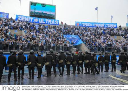 ITAR-TASS: ST PETERSBURG, RUSSIA. MAY 11, 2014. Riot police facing Zenit fans at a Russian Premier League Round 29 football match between Zenit St Petersburg and Dynamo Moscow at Petrovsky Stadium. An hour and 26 minutes into the match, Zenit fans ran onto the pitch causing the match to be stopped.  RE143775