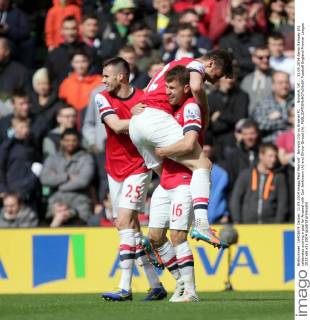 Norwich City vs Arsenal FC . . Norwich, UK . . 11.05.2014 Aaron Ramsey (A) celebrates scoring a goal for Arsenal with Carl Jenkinson (A) and Olivier Giroud (A). 