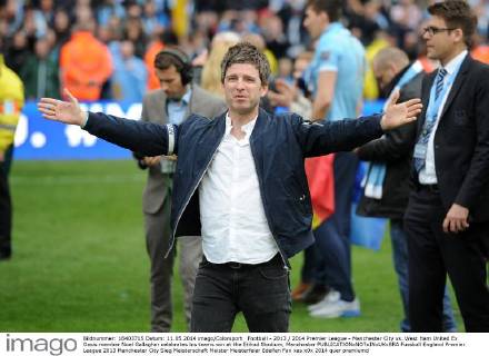 Football - 2013 2014 Premier League - Manchester City vs. West Ham United Ex Oasis member Noel Gallagher celebrates his teams win at the Etihad Stadium, Manchester 