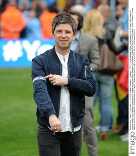 Football - 2013 2014 Premier League - Manchester City vs. West Ham United Ex Oasis member Noel Gallagher celebrates his teams win at the Etihad Stadium, Manchester 