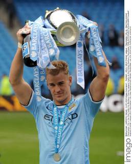 Football - 2013 2014 Premier League - Manchester City vs. West Ham United Manchester City s Joe Hart holds the Barclays Premier League trophy at the Etihad Stadium, Manchester 
