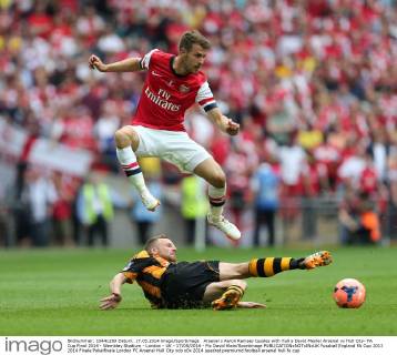 Arsenal s Aaron Ramsey tussles with Hull s David Meyler Arsenal vs Hull City- FA Cup Final 2014 - Wembley Stadium - London - UK - 17 05 2014 - Pic David Klein Sportimage EDITORIAL USE ONLY. No use with unauthorised audio, video, data, fixture lists, club league logos or live services. Online in-match use limited to 120 images, no video emulation. No use in betting, games or single club league player publications.