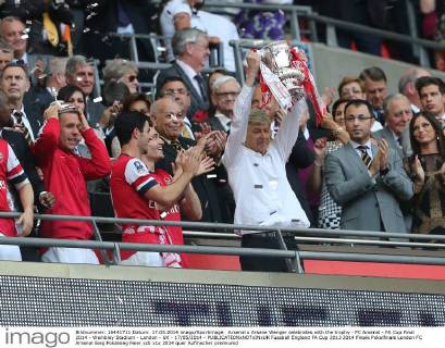 Arsenal s Arsene Wenger celebrates with the trophy - FC Arsenal - FA Cup Final 2014 - Wembley Stadium - London - UK - 17 05 2014 - EDITORIAL USE ONLY. No use with unauthorised audio, video, data, fixture lists, club league logos or live services. Online in-match use limited to 120 images, no video emulation. No use in betting, games or single club league player publications.