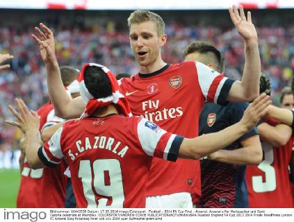 Football - 2014 FA Cup Final - Arsenal. Arsenal s Per Mertesacker and Santi Cazorla celebrate at Wembley. COLORSPORT ANDREW COWIE 