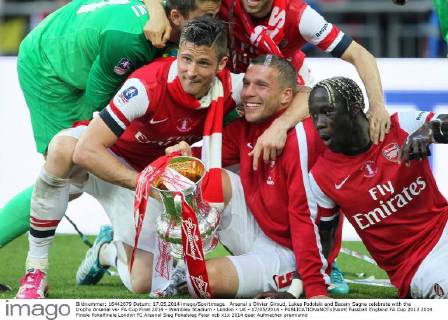 Arsenal s Olivier Giroud, Lukas Podolski and Bacary Sagna celebrate with the trophy Arsenal vs- FA Cup Final 2014 - Wembley Stadium - London - UK - 17 05 2014 - EDITORIAL USE ONLY. No use with unauthorised audio, video, data, fixture lists, club league logos or live services. Online in-match use limited to 120 images, no video emulation. No use in betting, games or single club league player publications.