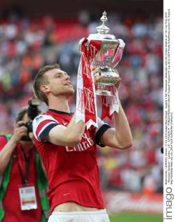 Arsenal s Per Mertsacker celebrates with the trophy Arsenal vs- FA Cup Final 2014 - Wembley Stadium - London - UK - 17 05 2014 - EDITORIAL USE ONLY. No use with unauthorised audio, video, data, fixture lists, club league logos or live services. Online in-match use limited to 120 images, no video emulation. No use in betting, games or single club league player publications.