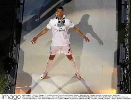 Real Madrid s Cristiano Ronaldo celebrates with supporters after winning the UEFA Champions League 2014, at Santiago Bernabeu stadium.