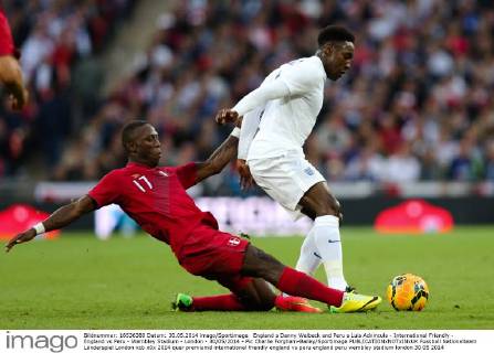 England s Danny Welbeck and Peru s Luis Advincula - International Friendly - England vs Peru - Wembley Stadium - London - 30 05 2014 - Pic Charlie Forgham-Bailey Sportimage EDITORIAL USE ONLY. No use with unauthorised audio, video, data, fixture lists, club league logos or live services. Online in-match use limited to 120 images, no video emulation. No use in betting, games or single club league player publications.