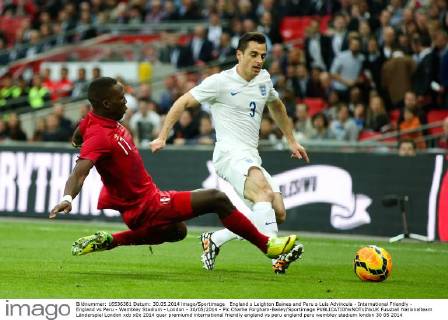 England s Leighton Baines and Peru s Luis Advincula - International Friendly - England vs Peru - Wembley Stadium - London - 30 05 2014 - Pic Charlie Forgham-Bailey Sportimage EDITORIAL USE ONLY. No use with unauthorised audio, video, data, fixture lists, club league logos or live services. Online in-match use limited to 120 images, no video emulation. No use in betting, games or single club league player publications.