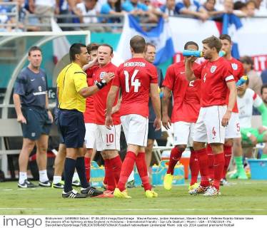 Wayne Rooney, jordan Henderson, Steven Gerrard - Referee Ricardo Salazar takes the players off as lightning strikes England vs Honduras - International Friendly - Sun Life Stadium - Miami - USA - 07 06 2014 - Pic DavidxKlein Sportimage EDITORIAL USE ONLY. No use with unauthorised audio, video, data, fixture lists, club league logos or live services. Online in-match use limited to 120 images, no video emulation. No use in betting, games or single club league player publications.