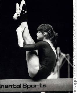 Apr. 15, 1977 - Champions All International Gymnastics Tournament At Empire Pool Wembley: The line up for the British Amateur Gymnastics Association Daily Mirror Champions All International Gymanstics Tournament which takes place tomorrow at the Empire Pool Wembley. For the first time in the history of the event the two current champions will be defending their titles. Teodora Ungureanu from Rumania, rated as number 3 in the world, and Peter Korman of America. who was an Olympic bronze medalist in Montreal. Photo shows Nadia Comaneci of Rumania the star gymnast of the Montreal Olympics - seen on the beam at the Empire Pool, Wembley today.  - ZUMAk09