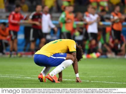 (140708) -- BELO HORIZONTE, July 8, 2014 (Xinhua) -- Brazil s Dante reacts after a semifinal match between Brazil and Germany of 2014 FIFA World Cup at the Estadio Mineirao Stadium in Belo Horizonte, Brazil, on July 8, 2014. Germany won 7-1 over Brazil and qualified for the final on Tuesday.(Xinhua Li Ga)(rh) (SP)BRAZIL-BELO HORIZONTE-WORLD CUP 2014-SEMIFINALS-BRAZIL VS GERMANY 