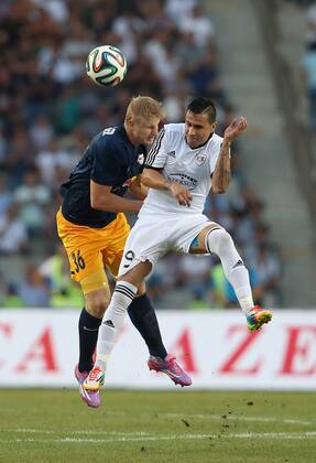 SOCCER - CL, Karabag vs RBS BAKU,AZERBAIJAN,30.JUL.14 - SOCCER - UEFA Champions League, qualifying, Karabag Agdam FK vs Red Bull Salzburg. Image shows Martin Hinteregger (RBS) and Reynaldo (Karabag).