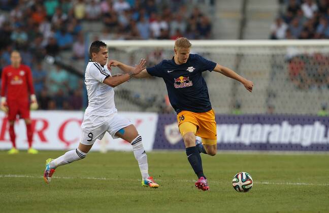 SOCCER - CL, Karabag vs RBS BAKU,AZERBAIJAN,30.JUL.14 - SOCCER - UEFA Champions League, qualifying, Karabag Agdam FK vs Red Bull Salzburg. Image shows Reynaldo (Karabag) and Martin Hinteregger (RBS).