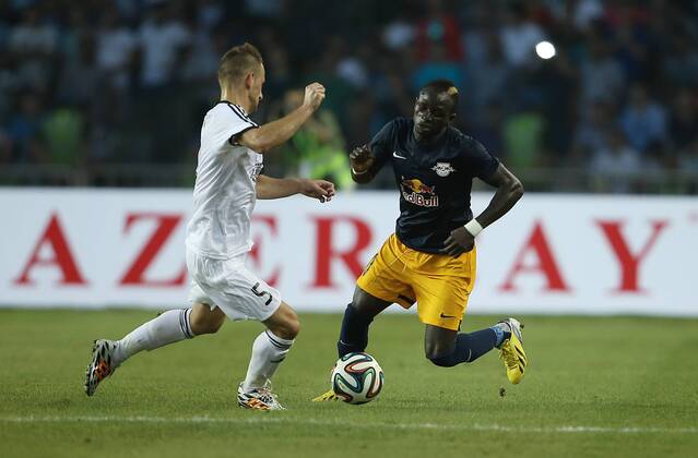 SOCCER - CL, Qarabag vs RBS BAKU,AZERBAIJAN,30.JUL.14 - SOCCER - UEFA Champions League, qualifying, Qarabag Agdam FK vs Red Bull Salzburg. Image shows Maksim Medvedev (Qarabag) and Sadio Mane (RBS).