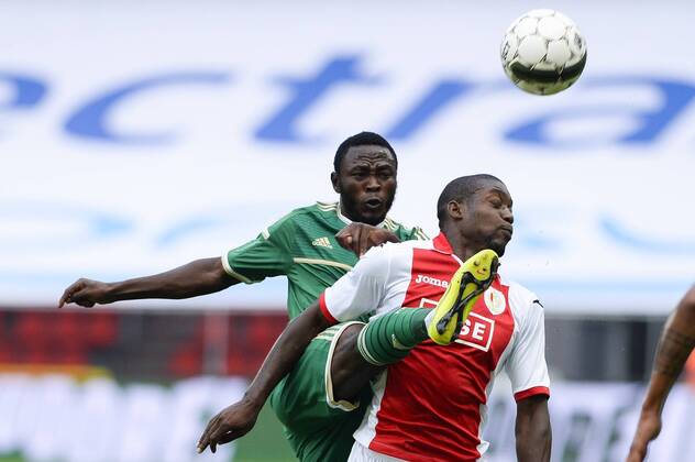 20140730 - LIEGE, BELGIUM: Panathinaikos Abdul Jeleel Ajagun and Standard s Geoffrey Mujangi Bia fight for the ball during a soccer game between Belgian first division team Standard de Liege and Greek Panathinaikos F.C., Wednesday 30 July 2014, in Liege, the first leg of the third qualifying round for the UEFA Champions League tournament. LAURIExDIEFFEMBACQ  premiumd 97431222