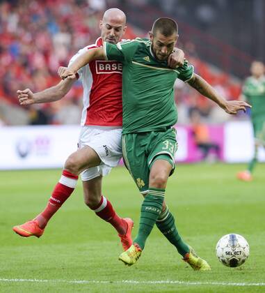 20140730 - LIEGE, BELGIUM: Standard s Laurent Ciman and Panathinaikos Mladen Petric fight for the ball during a soccer game between Belgian first division team Standard de Liege and Greek Panathinaikos F.C., Wednesday 30 July 2014, in Liege, the first leg of the third qualifying round for the UEFA Champions League tournament. LAURIExDIEFFEMBACQ  premiumd 97431404