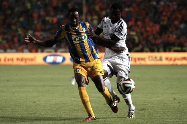 Vinicius of Apoel and Baah of Helsinki fight for the ball during their Champions League third qualifying round second leg against HJK Helsinki at GSP stadium in Nicosia, Cyprus, Tuesday, August 6, 2014 APOEL vs HJK Helsinki Champions League 2014 2015
