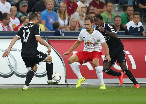 SOCCER - CL, RBS vs Qarabag SALZBURG,AUSTRIA,06.AUG.14 - SOCCER - UEFA Champions League, qualifying, Red Bull Salzburg vs Qarabag Agdam FK. Image shows Vueqar Nadirov (Qarabag), Andreas Ulmer (RBS) and Leroy George (Qarabag). 