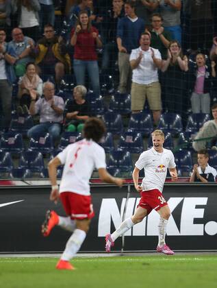 SOCCER - CL, RBS vs Qarabag SALZBURG,AUSTRIA,06.AUG.14 - SOCCER - UEFA Champions League, qualifying, Red Bull Salzburg vs Qarabag Agdam FK. Image shows the rejoicing of Martin Hinteregger (RBS). 