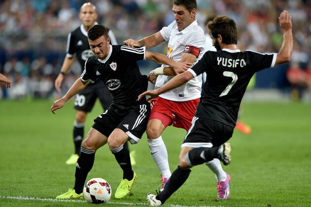 SOCCER - CL, RBS vs Qarabag SALZBURG,AUSTRIA,06.AUG.14 - SOCCER - UEFA Champions League, qualifying, Red Bull Salzburg vs Qarabag Agdam FK. Image shows Qara Qarayev (Qarabag), Jonatan Soriano (RBS) and Namig Yusifov (Qarabag). 