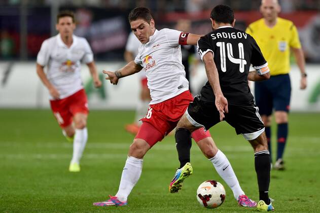 SOCCER - CL, RBS vs Qarabag SALZBURG,AUSTRIA,06.AUG.14 - SOCCER - UEFA Champions League, qualifying, Red Bull Salzburg vs Qarabag Agdam FK. Image shows Jonatan Soriano (RBS) and Rashad Sadygov (Qarabag). 