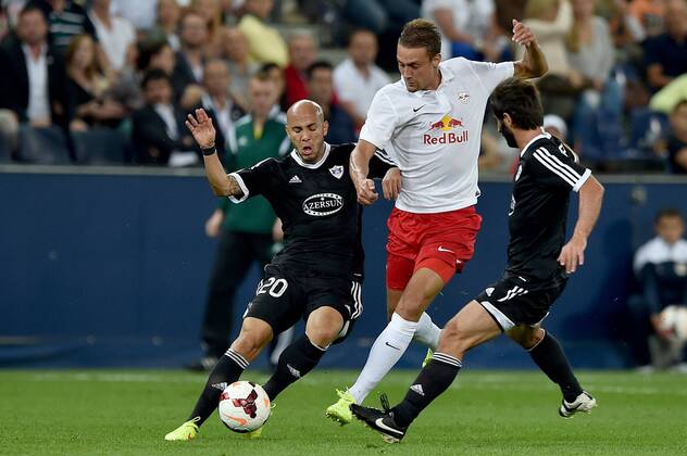 SOCCER - CL, RBS vs Qarabag SALZBURG,AUSTRIA,06.AUG.14 - SOCCER - UEFA Champions League, qualifying, Red Bull Salzburg vs Qarabag Agdam FK. Image shows Richard Almeida (Qarabag) and Stefan Ilsanker (RBS). 