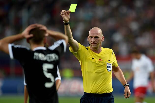 SOCCER - CL, RBS vs Qarabag SALZBURG,AUSTRIA,06.AUG.14 - SOCCER - UEFA Champions League, qualifying, Red Bull Salzburg vs Qarabag Agdam FK. Image shows Maksim Medvedev (Qarabag) and referee Bobby Madden. Keywords: yellow card. 