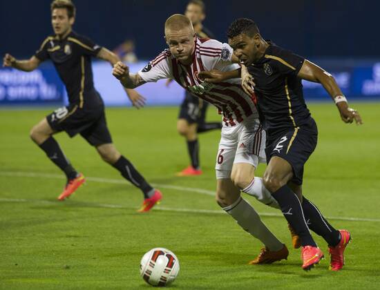El Arabi Hilal Soudani (1st R) of Dinamo Zagreb vies with Nicolaj Thomsen of Aalborg during UEFA Champions League 3rd Qualifying Round soccer match at the Maksimir Stadium in Zagreb, Croatia, Aug. 6, 2014. Aalborg won 2-0. ) (SP)CROATIA-ZAGREB-UEFA CHAMPIONS LEAGUE QUALIFYING MATCH MisoxLisanin 