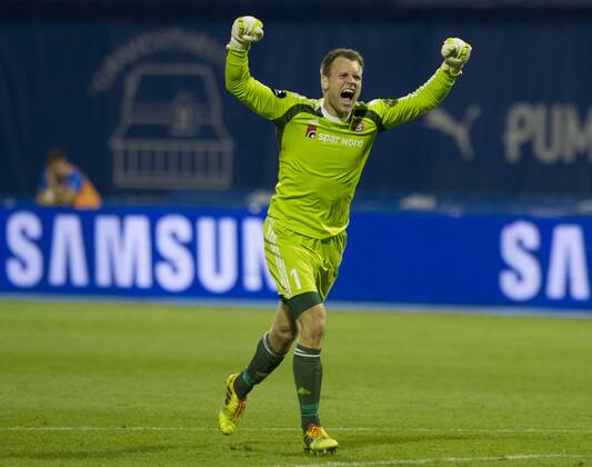 Goalkeeper Nicolai Larsen of Aalborg celebrates during UEFA Champions League 3rd Qualifying Round soccer match against Dinamo Zagreb at the Maksimir Stadium in Zagreb, Croatia, Aug. 6, 2014. Aalborg won 2-0. ) (SP)CROATIA-ZAGREB-UEFA CHAMPIONS LEAGUE QUALIFYING MATCH MisoxLisanin 