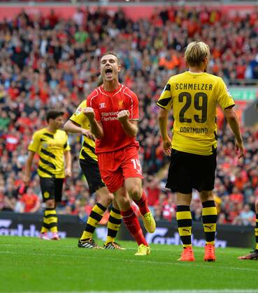 Liverpool s Jordan Henderson celebrates scoring the 4th goal- Pre Season Friendly - Liverpool vs Borussia Dortmund - Anfield Stadium - Liverpool - England - 10th August 2014 - Pic Paul Currie Sportimage EDITORIAL USE ONLY. No use with unauthorised audio, video, data, fixture lists, club league logos or live services. Online in-match use limited to 120 images, no video emulation. No use in betting, games or single club league player publications.