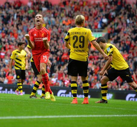 Liverpool s Jordan Henderson celebrates scoring the 4th goal- Pre Season Friendly - Liverpool vs Borussia Dortmund - Anfield Stadium - Liverpool - England - 10th August 2014 - Pic Paul Currie Sportimage EDITORIAL USE ONLY. No use with unauthorised audio, video, data, fixture lists, club league logos or live services. Online in-match use limited to 120 images, no video emulation. No use in betting, games or single club league player publications.