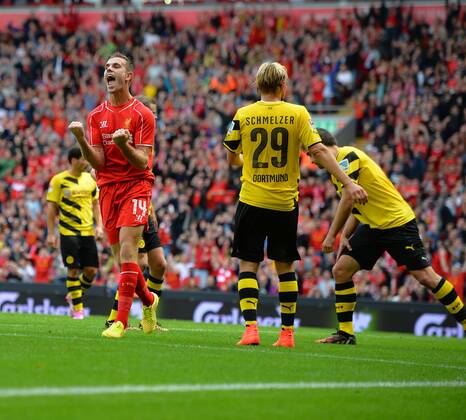 Liverpool s Jordan Henderson celebrates scoring the 4th goal- Pre Season Friendly - Liverpool vs Borussia Dortmund - Anfield Stadium - Liverpool - England - 10th August 2014 - Pic Paul Currie Sportimage EDITORIAL USE ONLY. No use with unauthorised audio, video, data, fixture lists, club league logos or live services. Online in-match use limited to 120 images, no video emulation. No use in betting, games or single club league player publications.