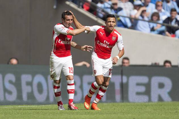 Arsenal s Santi Cazorla celebrates his opening goal with Alexis Sanchez - Arsenal vs. Manchester City - The FA Community Shield - Wembley Stadium - London - 10 08 2014 Pic Philip Oldham Sportimage EDITORIAL USE ONLY. No use with unauthorised audio, video, data, fixture lists, club league logos or live services. Online in-match use limited to 120 images, no video emulation. No use in betting, games or single club league player publications.