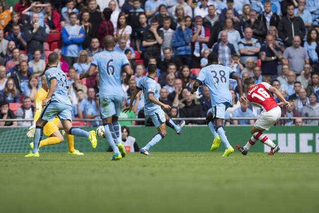 Arsenal s Aaron Ramsey scores his sides second goal - Arsenal vs. Manchester City - The FA Community Shield - Wembley Stadium - London - 10 08 2014 Pic Philip Oldham Sportimage EDITORIAL USE ONLY. No use with unauthorised audio, video, data, fixture lists, club league logos or live services. Online in-match use limited to 120 images, no video emulation. No use in betting, games or single club league player publications.