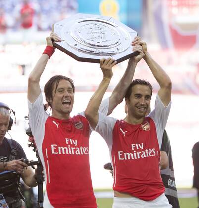Arsenal s Tomas Rosicky and Mathieu Flamini with the Community Shield - Arsenal vs. Manchester City - The FA Community Shield - Wembley Stadium - London - 10 08 2014 Pic Philip Oldham Sportimage EDITORIAL USE ONLY. No use with unauthorised audio, video, data, fixture lists, club league logos or live services. Online in-match use limited to 120 images, no video emulation. No use in betting, games or single club league player publications.