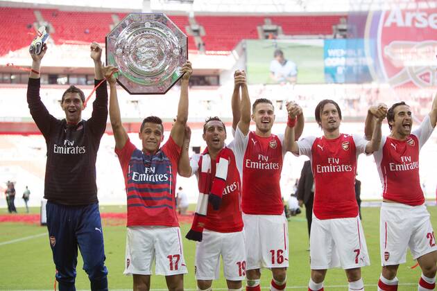 Arsenal s Alexis Sanchez lifts the Community Shield - Arsenal vs. Manchester City - The FA Community Shield - Wembley Stadium - London - 10 08 2014 EDITORIAL USE ONLY. No use with unauthorised audio, video, data, fixture lists, club league logos or live services. Online in-match use limited to 120 images, no video emulation. No use in betting, games or single club league player publications.