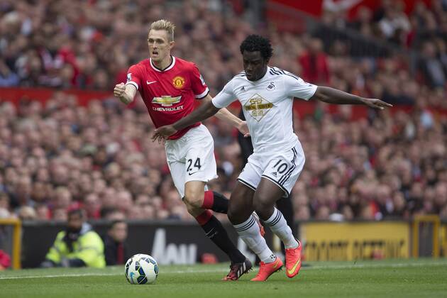 Darren Fletcher of Manchester United and Swansea s Wilfried Bony battle Manchester United ManU - Swansea City - Barclays Premier League - Old Trafford - Manchester - 16 08 2014 EDITORIAL USE ONLY. No use with unauthorised audio, video, data, fixture lists, club league logos or live services. Online in-match use limited to 120 images, no video emulation. No use in betting, games or single club league player publications.