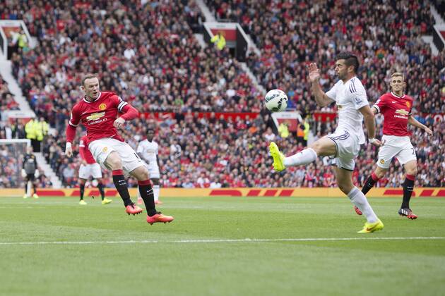 Wayne Rooney of Manchester United strikes at goal Manchester United ManU - Swansea City - Barclays Premier League - Old Trafford - Manchester - 16 08 2014 EDITORIAL USE ONLY. No use with unauthorised audio, video, data, fixture lists, club league logos or live services. Online in-match use limited to 120 images, no video emulation. No use in betting, games or single club league player publications.