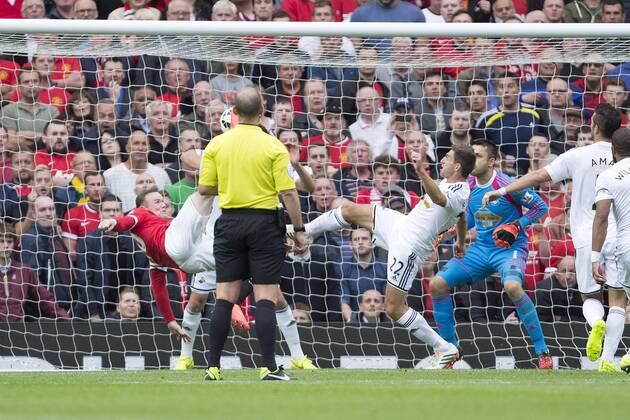 Wayne Rooney of Manchester United scores to level it at 1-1 - Manchester United vs. Swansea - Barclays Premier League - Old Trafford - Manchester - 16 08 2014 Pic Philip Oldham Sportimage EDITORIAL USE ONLY. No use with unauthorised audio, video, data, fixture lists, club league logos or live services. Online in-match use limited to 120 images, no video emulation. No use in betting, games or single club league player publications.