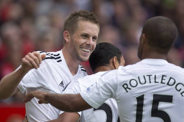Swansea s Gylfi Sigurdsson celebrates scoring his sides second goal - Manchester United vs. Swansea - Barclays Premier League - Old Trafford - Manchester - 16 08 2014 Pic Philip Oldham Sportimage EDITORIAL USE ONLY. No use with unauthorised audio, video, data, fixture lists, club league logos or live services. Online in-match use limited to 120 images, no video emulation. No use in betting, games or single club league player publications.