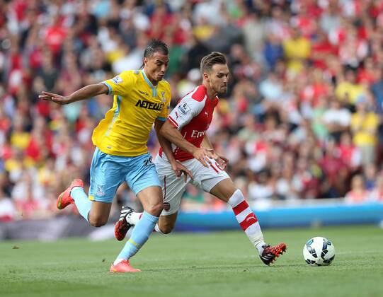Arsenal s Aaron Ramsey tussles with Crystal Palace s Marouane Chamakh - Barclays Premier League - Arsenal vs Crystal Palace - Emirates Stadium - London - England - 16th August 2014 - Picture David Klein Sportimage EDITORIAL USE ONLY. No use with unauthorised audio, video, data, fixture lists, club league logos or live services. Online in-match use limited to 120 images, no video emulation. No use in betting, games or single club league player publications.