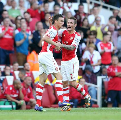 Arsenal s Laurent Koscielny celebrates scoring his sides opening goal with Mathieu Debuchy - Barclays Premier League - Arsenal vs Crystal Palace - Emirates Stadium - London - England - 16th August 2014 - Picture David Klein Sportimage EDITORIAL USE ONLY. No use with unauthorised audio, video, data, fixture lists, club league logos or live services. Online in-match use limited to 120 images, no video emulation. No use in betting, games or single club league player publications.