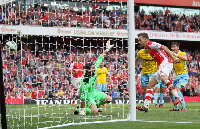 Arsenal s Aaron Ramsey scoring his sides second goal - Barclays Premier League - Arsenal vs Crystal Palace - Emirates Stadium - London - England - 16th August 2014 - Picture David Klein Sportimage EDITORIAL USE ONLY. No use with unauthorised audio, video, data, fixture lists, club league logos or live services. Online in-match use limited to 120 images, no video emulation. No use in betting, games or single club league player publications.