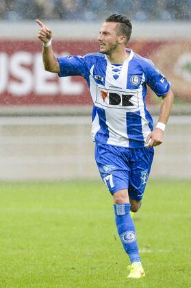 20140817 - GENT, BELGIUM: Gent s Danijel Milicevic celebrates after scoring during the Jupiler Pro League match between KAA Gent and Zulte Waregem, in Gent, Sunday 17 August 2014, on day 4 of the Belgian soccer championship. LAURIExDIEFFEMBACQ 04280380