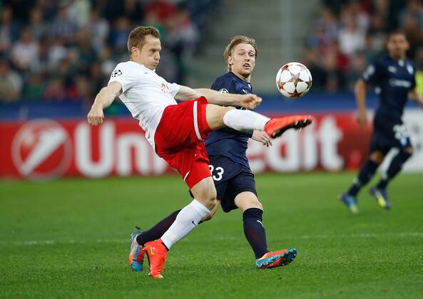 SOCCER - CL, RBS vs Malmö SALZBURG,AUSTRIA,19.AUG.14 - SOCCER - UEFA Champions League, play off, Red Bull Salzburg vs Malmö FF. Image shows Christian Schwegler (RBS) and Emil Forsberg (Malmö). 