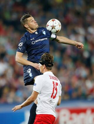 SOCCER - CL, RBS vs Malmö SALZBURG,AUSTRIA,19.AUG.14 - SOCCER - UEFA Champions League, play off, Red Bull Salzburg vs Malmö FF. Image shows Markus Rosenberg (Malmö) and Franz Schiemer (RBS). 