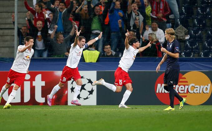 SOCCER - CL, RBS vs Malmö SALZBURG,AUSTRIA,19.AUG.14 - SOCCER - UEFA Champions League, play off, Red Bull Salzburg vs Malmö FF. Image shows the rejoicing of Christoph Leitgeb, Jonatan Soriano and Franz Schiemer (RBS). 