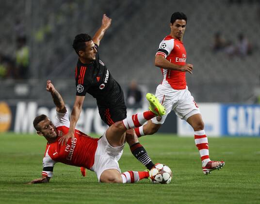 UEFA Champions League playoff first leg match match between Besiktas and Arsenal at Olympic stadium in istanbul 19 august 2014. Pictured: Mustafa Pektemek of Besiktas and Mikel Arteta (R) of Arsenal. 